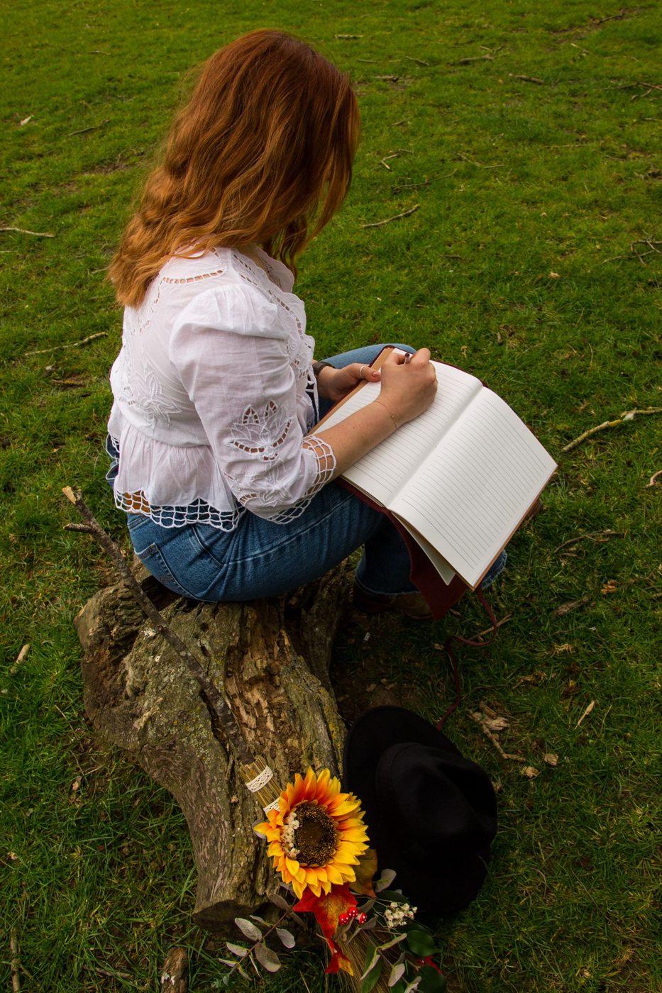 Hannah Collins writing in a journal